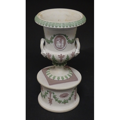 92 - A pair of Samuel Alcock bisque / parian ewers with decorated with encrusted flowers and relief bunch... 