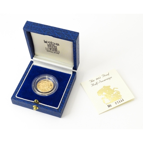 818 - Coin : An Elizabeth II 1985 gold proof half sovereign. With box and certificate.