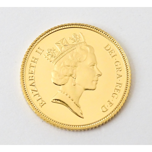 818 - Coin : An Elizabeth II 1985 gold proof half sovereign. With box and certificate.