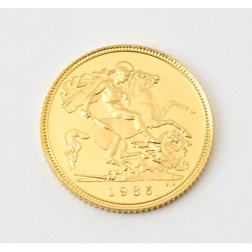 818 - Coin : An Elizabeth II 1985 gold proof half sovereign. With box and certificate.