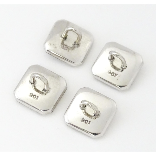 781 - A cased set of 9ct white gold studs and cufflinks with engine turned decoration and seed pearl detai... 