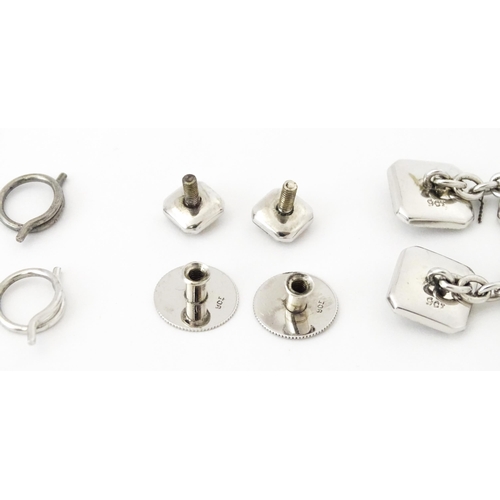 781 - A cased set of 9ct white gold studs and cufflinks with engine turned decoration and seed pearl detai... 