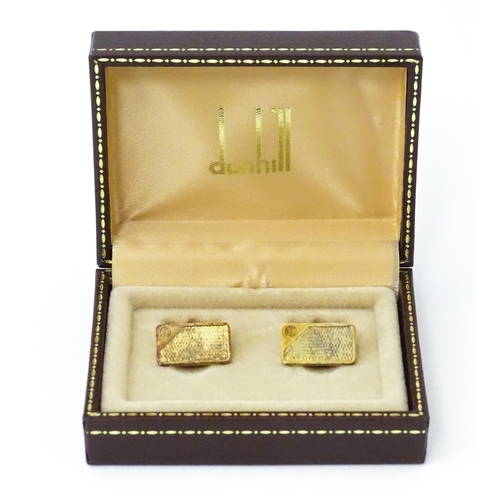 782 - A cased pair of silver gilt cufflinks by Dunhill hallmarked London 1983, maker Alfred Dunhill & Sons... 