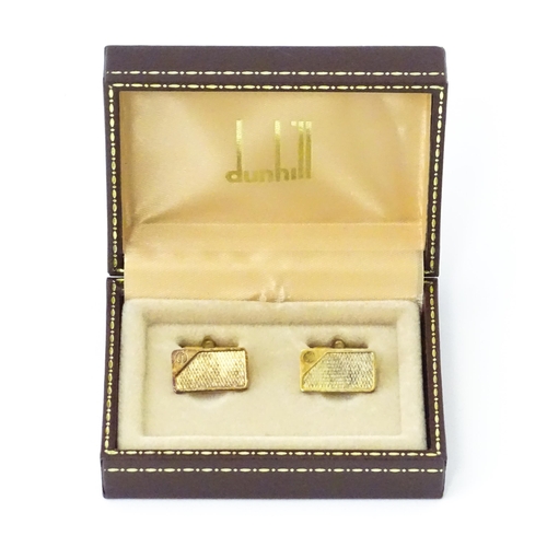 782 - A cased pair of silver gilt cufflinks by Dunhill hallmarked London 1983, maker Alfred Dunhill & Sons... 