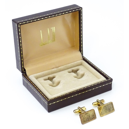 782 - A cased pair of silver gilt cufflinks by Dunhill hallmarked London 1983, maker Alfred Dunhill & Sons... 