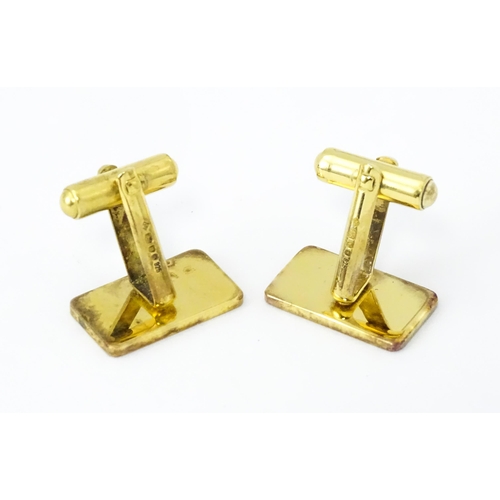 782 - A cased pair of silver gilt cufflinks by Dunhill hallmarked London 1983, maker Alfred Dunhill & Sons... 