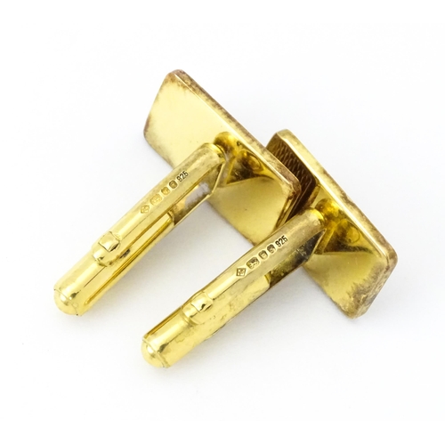 782 - A cased pair of silver gilt cufflinks by Dunhill hallmarked London 1983, maker Alfred Dunhill & Sons... 