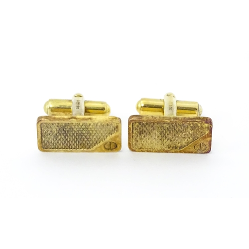 782 - A cased pair of silver gilt cufflinks by Dunhill hallmarked London 1983, maker Alfred Dunhill & Sons... 