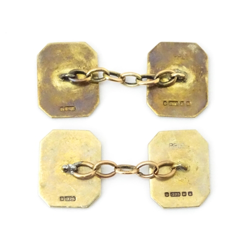 784 - A pair of 9ct gold cufflinks with checkerboard enamel detail