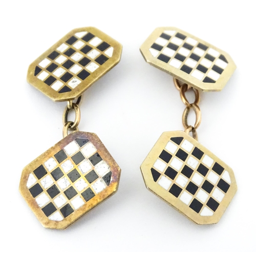 784 - A pair of 9ct gold cufflinks with checkerboard enamel detail