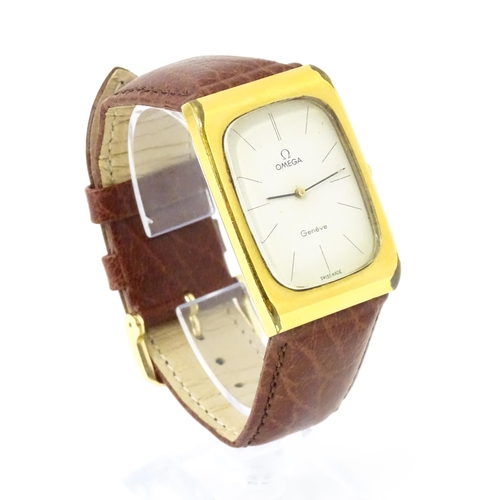 789 - A vintage gentleman's Omega manual wind wristwatch, the gold plated case with enamel dial signed 'Om... 