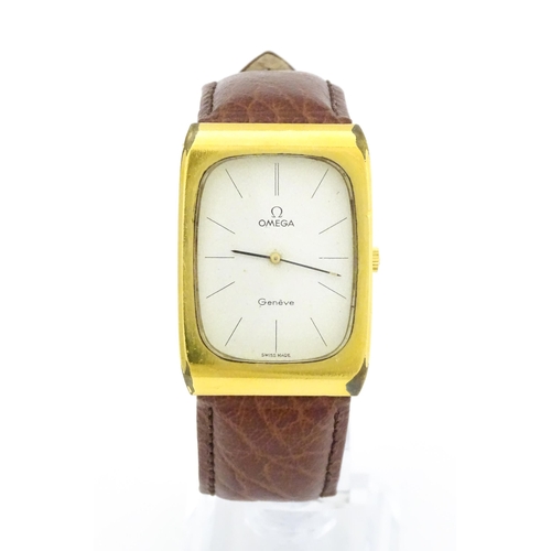 789 - A vintage gentleman's Omega manual wind wristwatch, the gold plated case with enamel dial signed 'Om... 