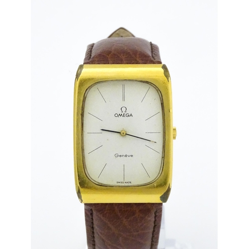 789 - A vintage gentleman's Omega manual wind wristwatch, the gold plated case with enamel dial signed 'Om... 