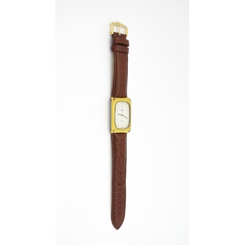 789 - A vintage gentleman's Omega manual wind wristwatch, the gold plated case with enamel dial signed 'Om... 