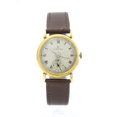 790 - A 9ct gold cased gentleman's Omega manual wind wristwatch the silvered dial signed Omega, with Roman... 