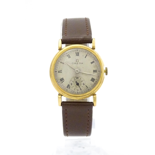 790 - A 9ct gold cased gentleman's Omega manual wind wristwatch the silvered dial signed Omega, with Roman... 