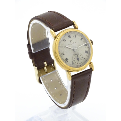 790 - A 9ct gold cased gentleman's Omega manual wind wristwatch the silvered dial signed Omega, with Roman... 