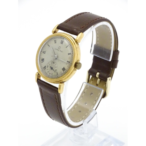 790 - A 9ct gold cased gentleman's Omega manual wind wristwatch the silvered dial signed Omega, with Roman... 