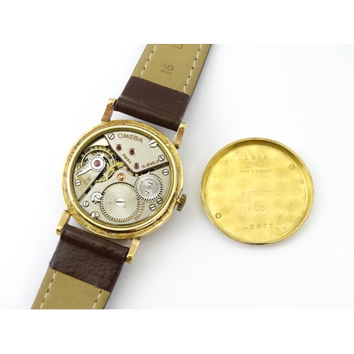 790 - A 9ct gold cased gentleman's Omega manual wind wristwatch the silvered dial signed Omega, with Roman... 