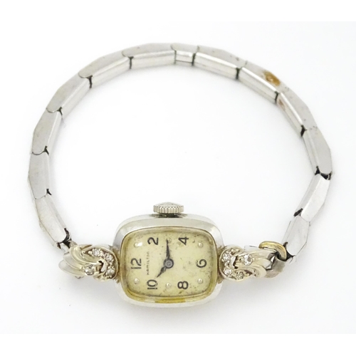 796 - A 14ct white gold cased ladies wristwatch set with diamonds to shoulders. The dial signed Hamilton W... 