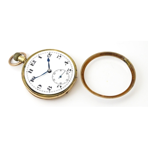 799 - A 9ct gold cased top wind pocket watch, with Arabic numerals and subsidiary seconds dial. The case b... 