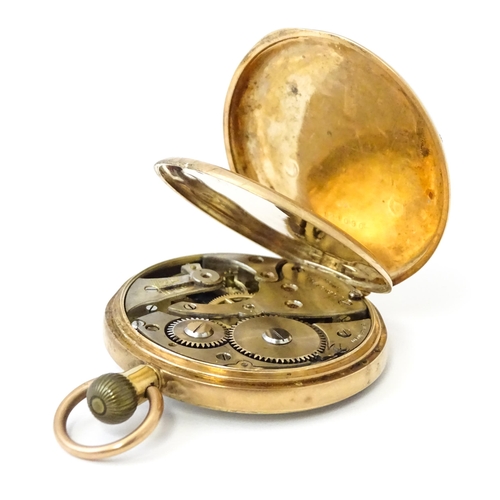 799 - A 9ct gold cased top wind pocket watch, with Arabic numerals and subsidiary seconds dial. The case b... 