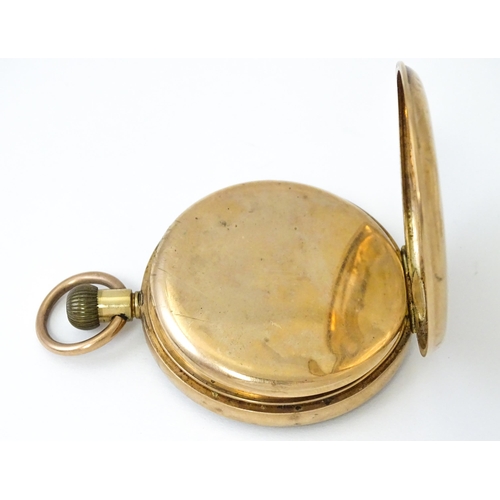 799 - A 9ct gold cased top wind pocket watch, with Arabic numerals and subsidiary seconds dial. The case b... 