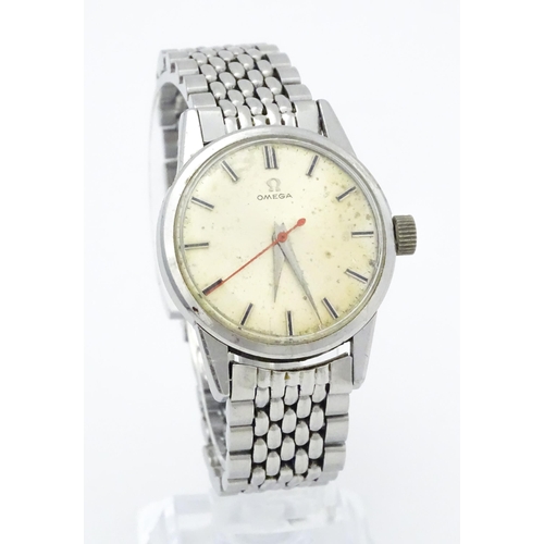 802 - A vintage gentleman's Omega wristwatch, the silvered dial with hour batons and red seconds hand. Wit... 