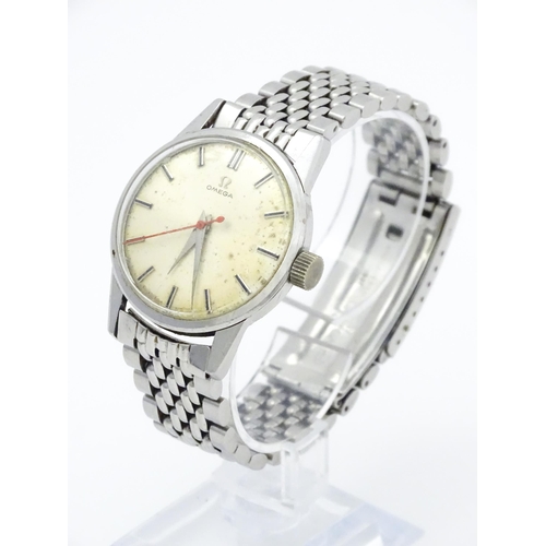 802 - A vintage gentleman's Omega wristwatch, the silvered dial with hour batons and red seconds hand. Wit... 