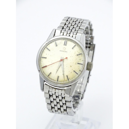 802 - A vintage gentleman's Omega wristwatch, the silvered dial with hour batons and red seconds hand. Wit... 