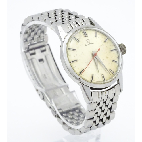 802 - A vintage gentleman's Omega wristwatch, the silvered dial with hour batons and red seconds hand. Wit... 