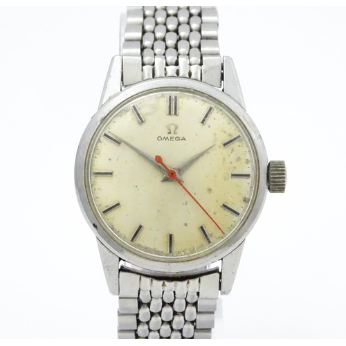 802 - A vintage gentleman's Omega wristwatch, the silvered dial with hour batons and red seconds hand. Wit... 