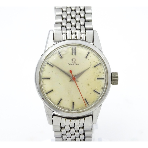 802 - A vintage gentleman's Omega wristwatch, the silvered dial with hour batons and red seconds hand. Wit... 