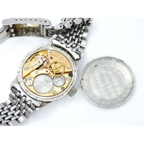 802 - A vintage gentleman's Omega wristwatch, the silvered dial with hour batons and red seconds hand. Wit... 