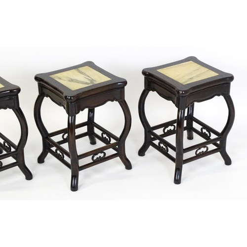 1443 - A mah-jong table and stools. Having marble tops above cabriole legs and double braced stretchers wit... 