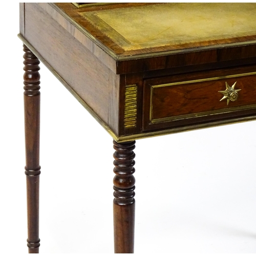 1448 - An early / mid 19thC rosewood Bonheur du jour with a brass gallery raised on four brass pillars, the... 