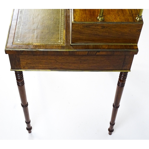 1448 - An early / mid 19thC rosewood Bonheur du jour with a brass gallery raised on four brass pillars, the... 