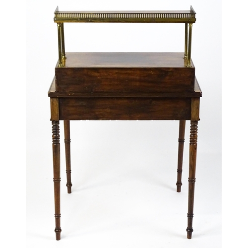 1448 - An early / mid 19thC rosewood Bonheur du jour with a brass gallery raised on four brass pillars, the... 