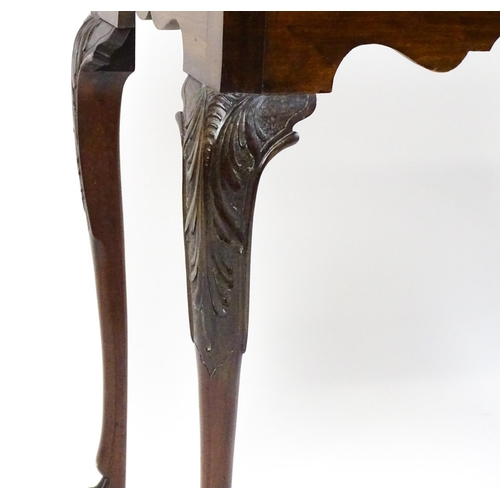 1450 - A late 18th / early 19thC Irish card table of mahogany construction. The table having a hinged top a... 