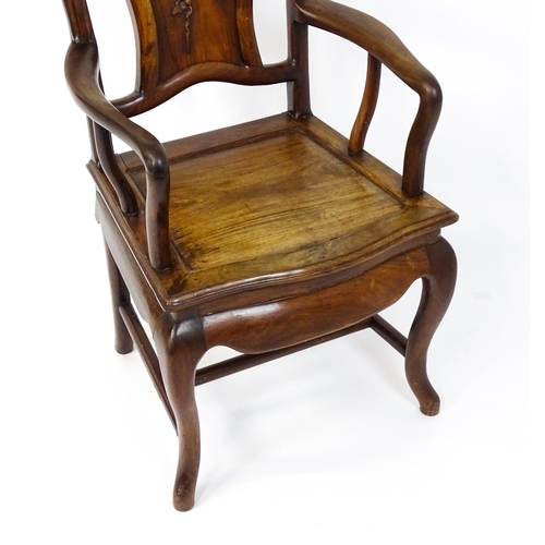 1463 - A 19thC Chinese armchair with a carved backrest, swept arms and raised on cabriole front legs. 21