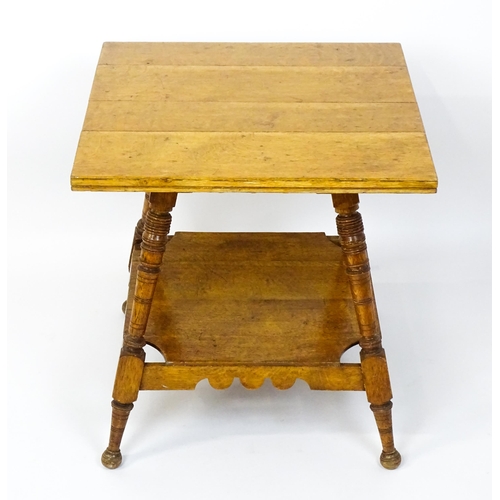 1466 - An Aesthetic movement oak table in the manner of Charles Locke Eastlake, the table having a squared ... 