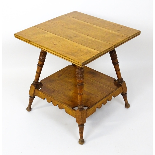 1466 - An Aesthetic movement oak table in the manner of Charles Locke Eastlake, the table having a squared ... 