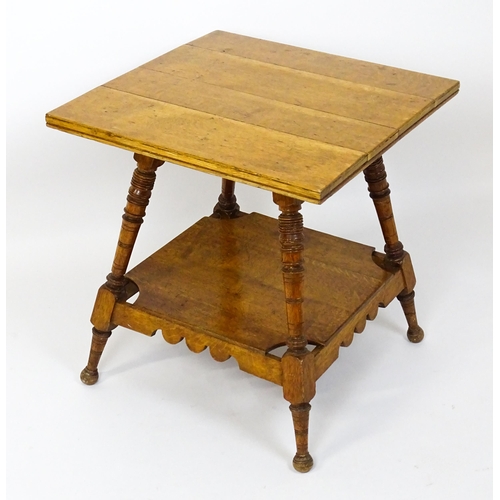 1466 - An Aesthetic movement oak table in the manner of Charles Locke Eastlake, the table having a squared ... 