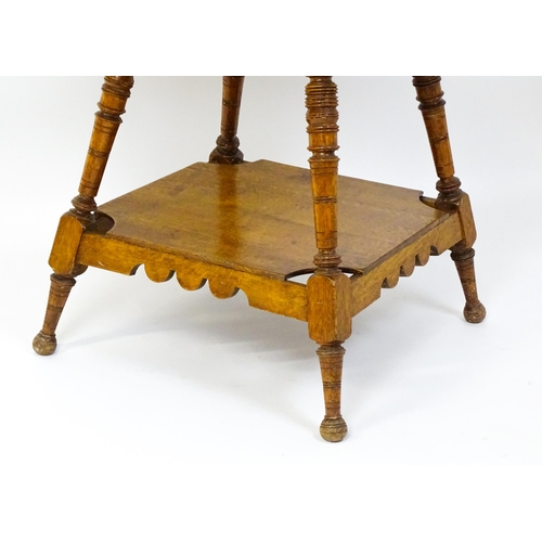 1466 - An Aesthetic movement oak table in the manner of Charles Locke Eastlake, the table having a squared ... 