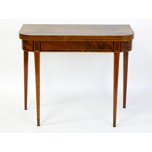 1468 - A late 18thC / early 19thC mahogany card table with satinwood crossbanded decoration, the table rais... 