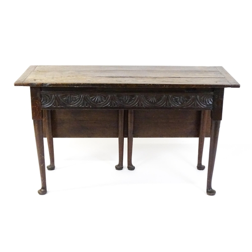 1493 - A Victorian oak gateleg table with nulled apron raised on six turned tapering legs terminating in pa... 