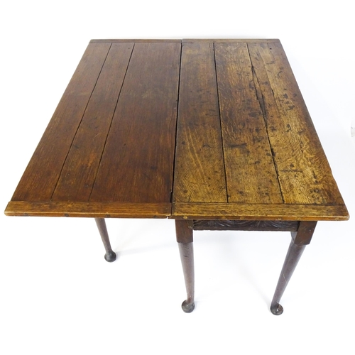 1493 - A Victorian oak gateleg table with nulled apron raised on six turned tapering legs terminating in pa... 