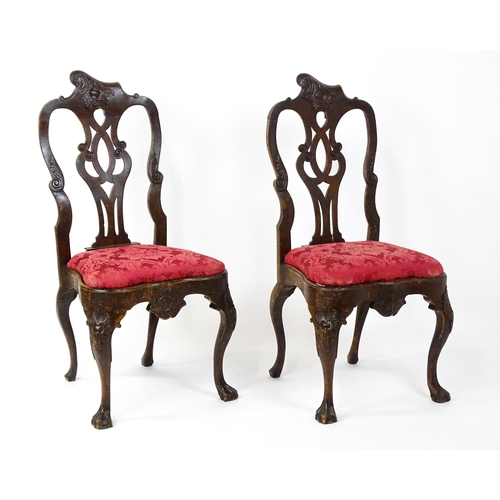 1581 - A pair of 18thC Anglo-Portuguese dining chairs with unusual shaped and carved cresting rails above p... 