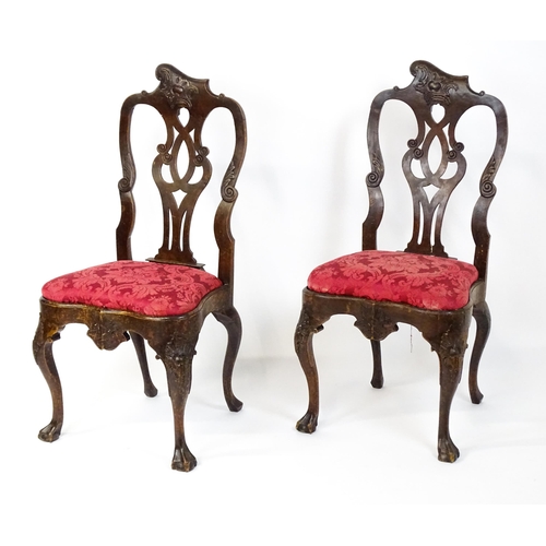 1581 - A pair of 18thC Anglo-Portuguese dining chairs with unusual shaped and carved cresting rails above p... 