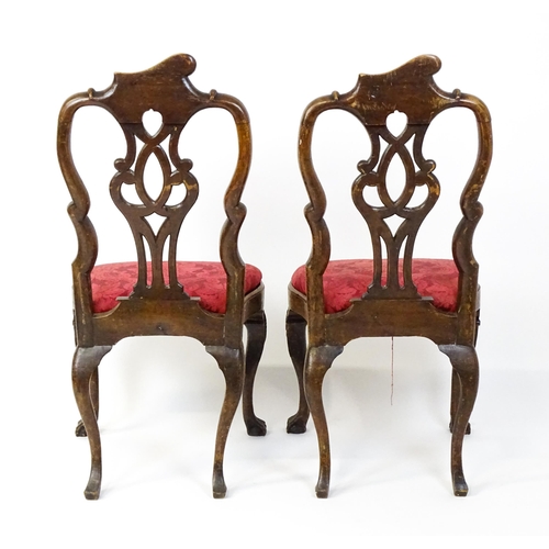 1581 - A pair of 18thC Anglo-Portuguese dining chairs with unusual shaped and carved cresting rails above p... 